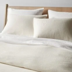 Plume Nude Bed -Furniture Store ivory hemp and white linen bedding 1