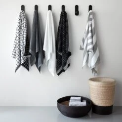 Mini Grid Black Bath Towel -Furniture Store pg 24 25 alternate 1 bath towels curve black hooks black band hamper nido 1 4