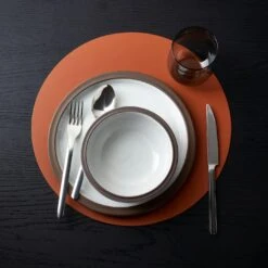 Dot Cognac Round Leather Placemat -Furniture Store tinge white dinnerware dot cognac placemat 4
